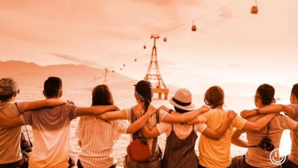 a group of people standing together with arms around each other